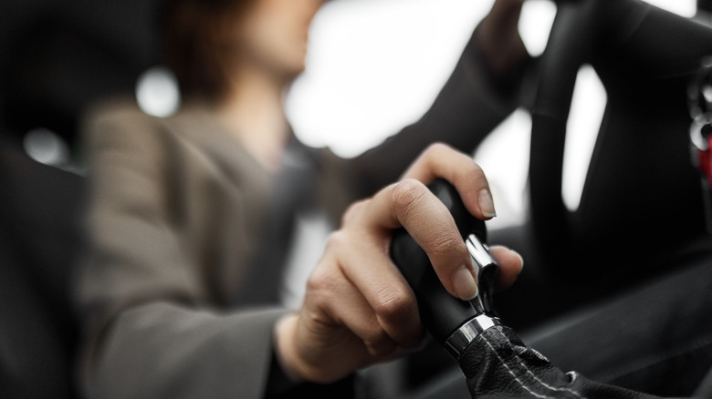 A lady performing a gear shift