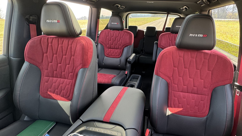 A look back at the red and black seats in the 2026 Nissan Armada Nismo with Nismo embroidered on the headrests
