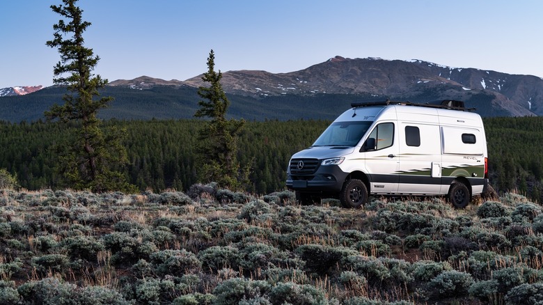 A 2021 Winnebago Revel parked in the mountains