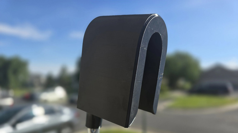 A 3d-printed cover, called a Flock Sock, covers a Flock camera.
