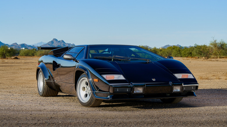 A front 3/4 of a black Lamborghini Countach 5000S.