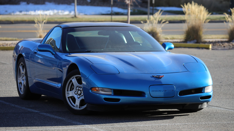 A front right 3/4 of a blue 1998 Chevrolet Corvette.