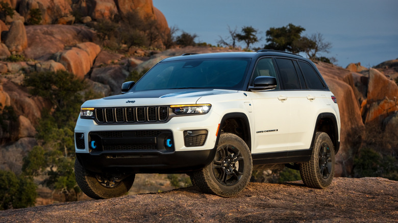 A 2022 Grand Jeep Cherokee parked on a rocky peak.