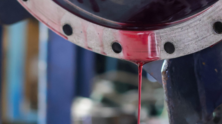 A Red automatic transmission fluid leaking from a dissembled gearbox