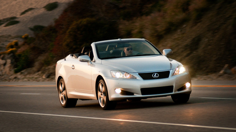 Front 3/4 view of a silver 2010 Lexus IS 250 C in motion.