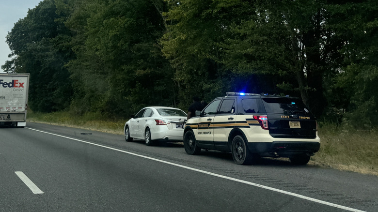 Tennessee State Patrol car behind a Nissan Altima