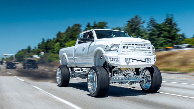 Lifted Ram pickup truck modified to roll coal