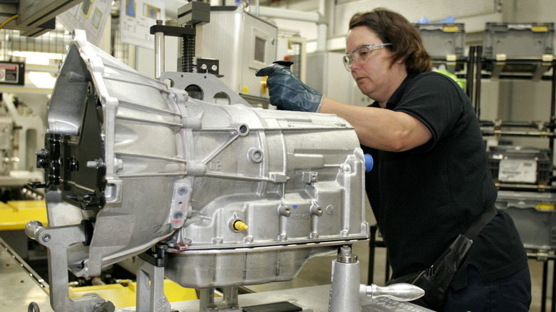 A person working on a new GM six-speed transmission at GM's Ypsilanti transmission plant in 2006