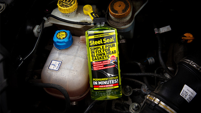 Bottle of Steel Seal in an engine bay