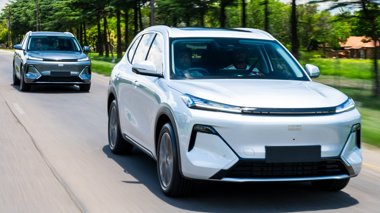 A pair of 2025 Geely E5 electrified cars driving in South Africa