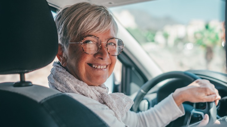 Older woman behind the wheel of a car