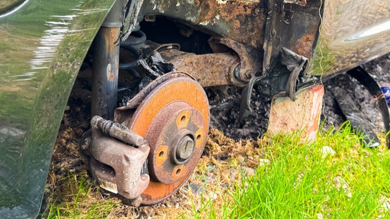 Rusted brakes and rotor in a salvage vehicle.