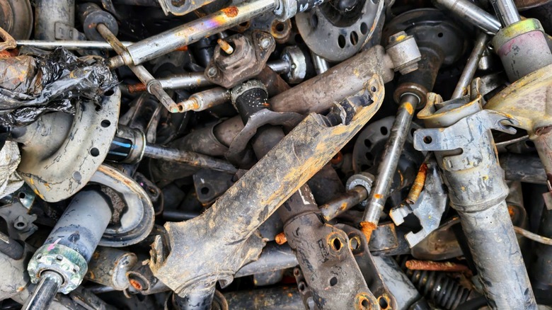 Shocks and struts in a salvage yard.
