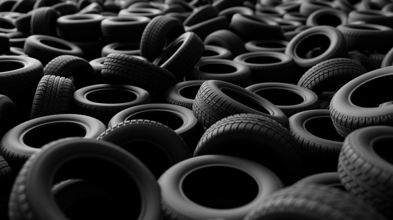 Dozens of automobile tires on display.