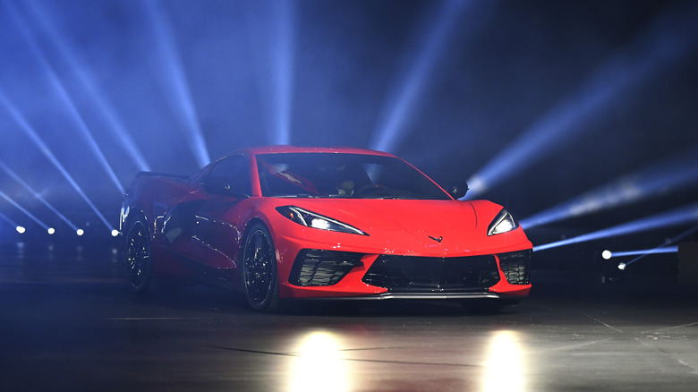 C8 Corvette coupe with laser lights shining behind it