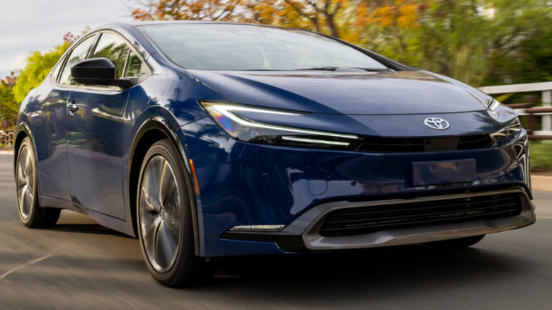 A blue 2026 Toyota Prius Limited on the highway