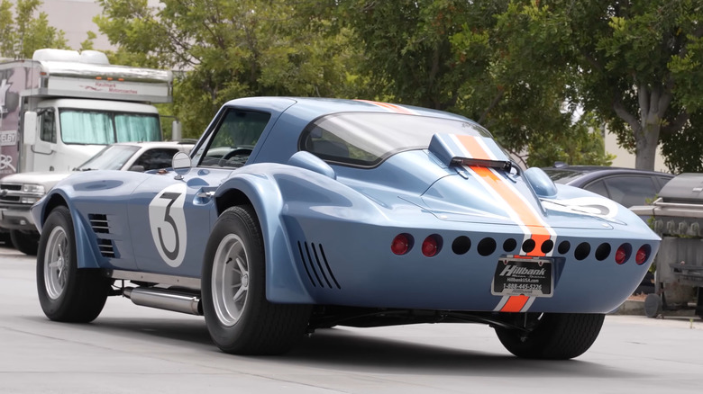 A rear-quarter shot of a blue 1963 Corvette Grand Sport recreation