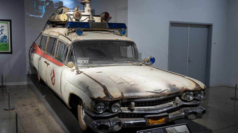 A deteriorated Ecto-1 in a museum