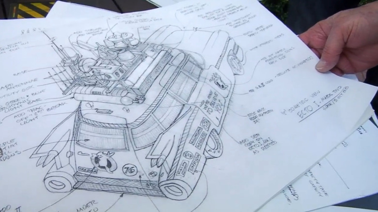 Stephen Dane showing off original drawings for the Ecto-1