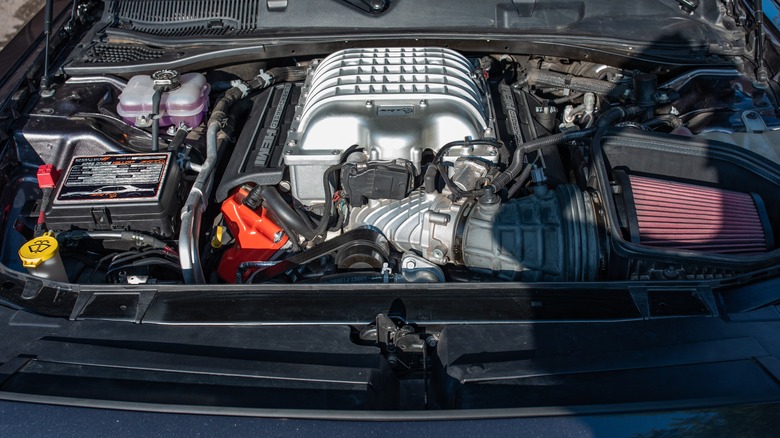 A Hellcat supercharged V8 engine in a Dodge Challenger