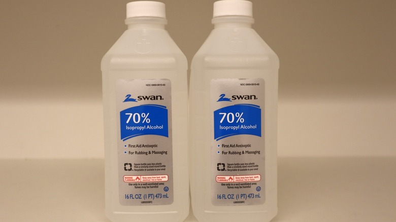 Two bottles of Swan Isopropyl Alcohol.