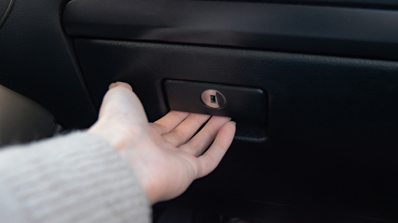 reaching for a glove box