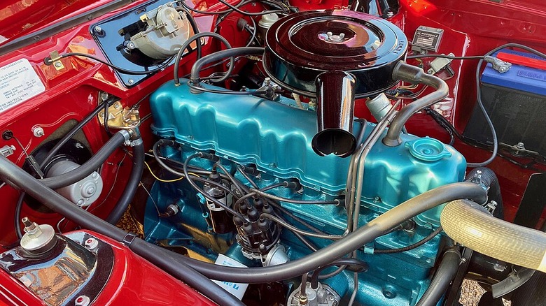 A right side view of the engine bay in a 1971 AMC Gremlin with a 232 cubic-inch straight-6 engine.