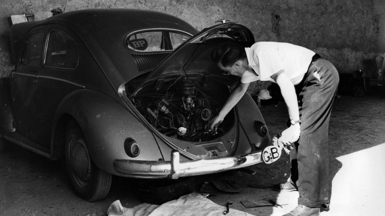 August 1955: During BP fuel tests in the Sahara desert, the heat from an engine of a VW beetle car is checked.