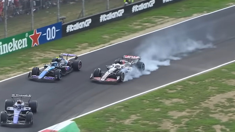 Magnussen locking-up, due to collide with Pierre Gasly