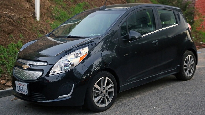 Black Chevrolet Spark EV parked on the street in California