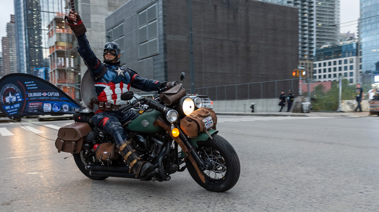 Captain America riding a Harley Davidson motorcycle