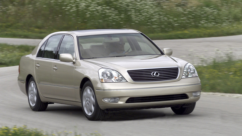 Front 3/4 view of a beige 2001-2003 Lexus LS 430 in motion.