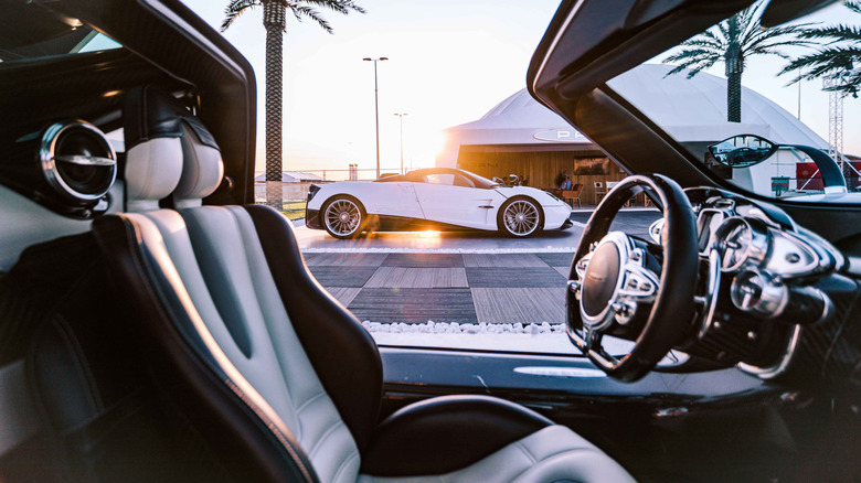 The side profile of the Pagani Huayra as shot through the cabin of another Huayra.