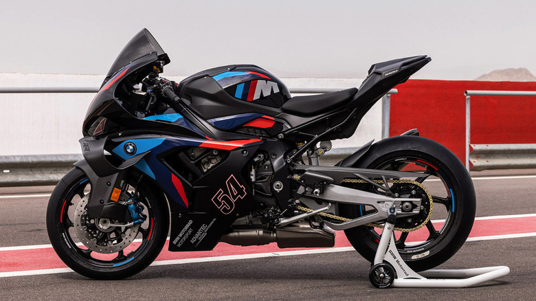 BMW M 1000 RR parked on a rear wheel stand, waiting to go on track
