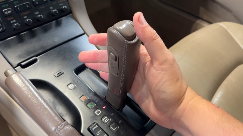 Doug DeMuro's hand operating the Aisin A340 transmission in a Lexus SC300