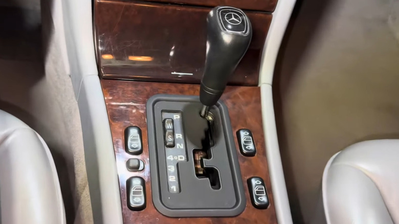 A closeup of the wood console and shifter for the 5G-Tronic 722.6 automatic transmission in a 1997 W210 Mercedes E320