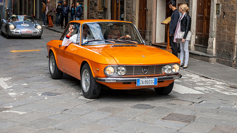 An Orange Lancia Fulvia at the Mille Miglia