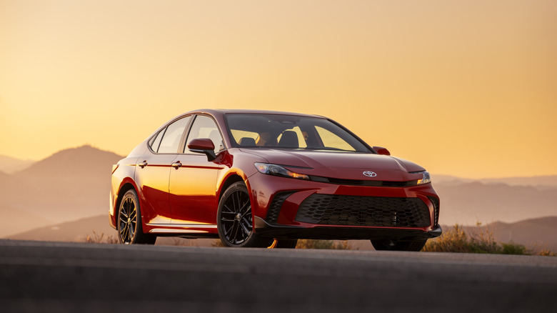 Front 3/4 view of a red 2026 Toyota Camry.