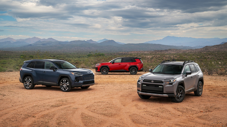 Three 2026 Toyota RAV4s parked on dirt