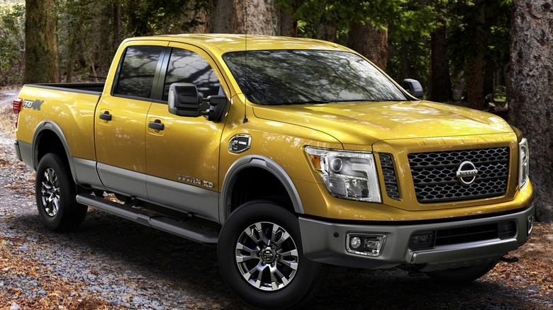 Front-quarter shot of a yellow 2016 Nissan Titan XD