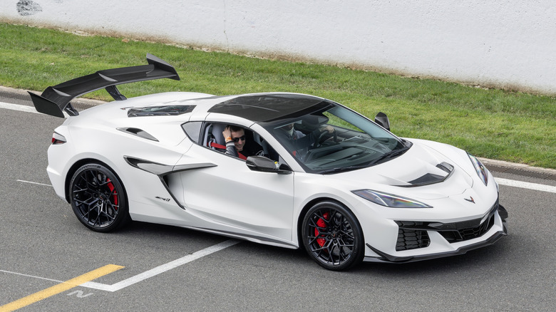 A white C8 Corvette ZR1 being driven on a track.