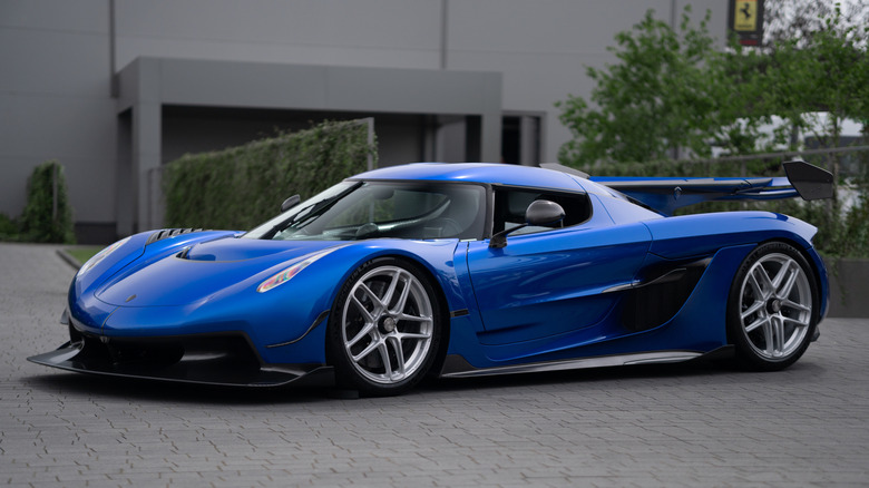 A parked blue Koenigsegg Jesko Attack.
