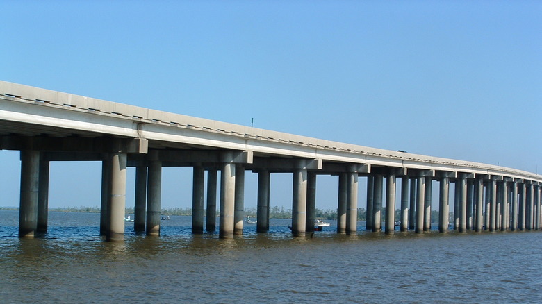 Manchac Swamp Bridge with boats under it in Lousiana