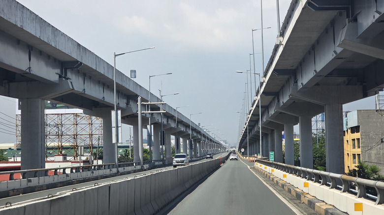 Looking up at the Metro Manila Skyway with bridges converging in the distance