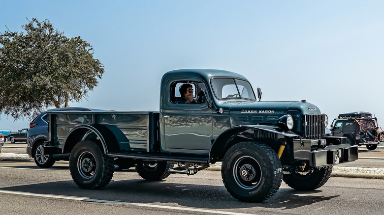 side shot of a green dodge power wagon in a parking lot