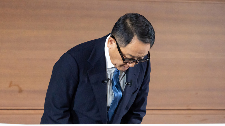 Toyota Chairman Akio Toyoda bows successful apology during a property conference.