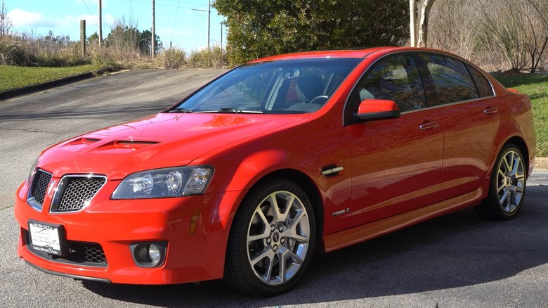 2009 Pontiac G8 GXP parked on a paved surface with trees in the background
