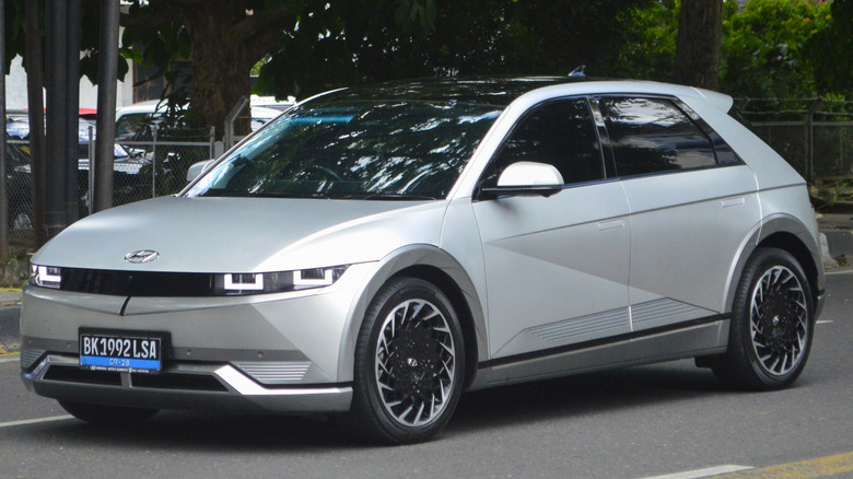A front left corner angle of a silver Hyundai Ioniq 5 on the street