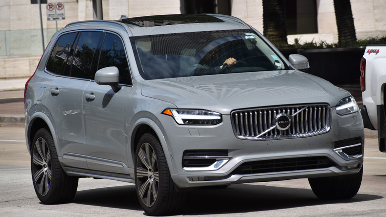 A front-right angle of a gray Volvo XC90 on the parking lot