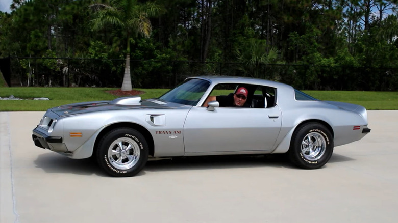A 1975 Yenko Pontiac Trans Am with someone inside it